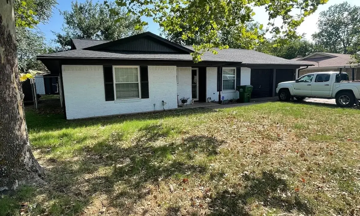Professional roofing crew working on a residential roof in Scriba